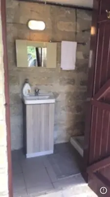 a bathroom with a sink and a mirror at Amalia Panorama House in Zanaja
