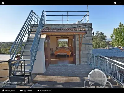 a staircase leading up to a house with a room at Amalia Panorama House in Zanaja