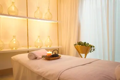 a room with a table with a candle and vases at Aelia Wellness Retreat in Nicosia