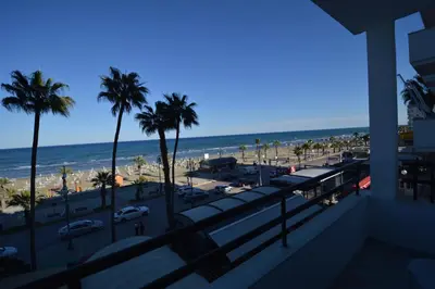 a view of the beach from the balcony of a building at Krasas Beach Flats in Larnaka