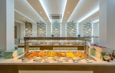a bakery with many different types of food on display at Stamatia Hotel in Ayia Napa