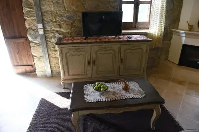 a living room with a table with fruit on it at Spiti tis Irinis in Pedoulas