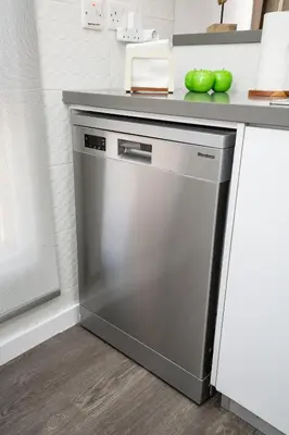 a dishwasher in a kitchen next to a counter at Lazuli Beachfront Sea View Ap144 in Larnaka