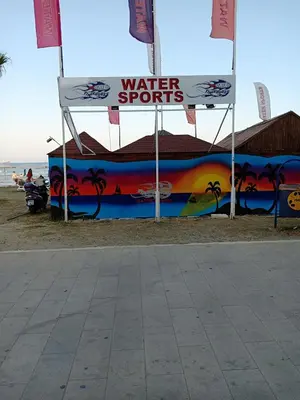 a sign that says water sports on the beach at Studio Apartment Near the Beach in Larnaka