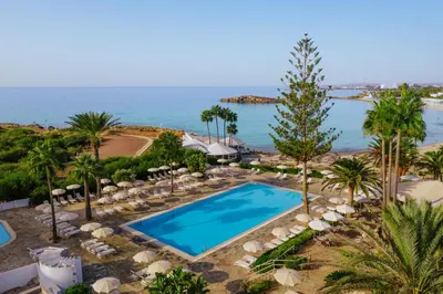 an aerial view of a resort with a swimming pool at Nissi Beach Resort in Ayia Napa