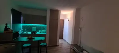 a kitchen with a green counter and a sink at Ha.De.Co. Holiday Apts in Ayia Napa