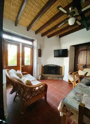 a living room with a couch and a fireplace at Arhontiko Askas Mansion in Askas