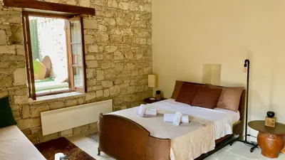 a bedroom with a bed with towels on it at Listed Villa in Laneia in Lania