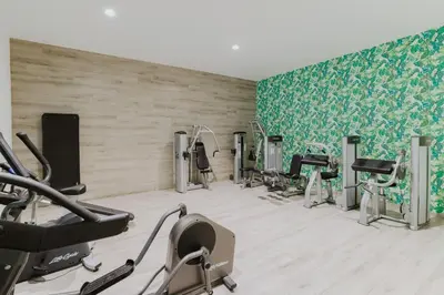 a gym with several treadmills and cardio machines at Seasons Hotel (Adults Only) in Ayia Napa