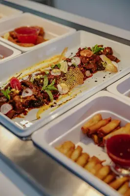 a table with three plates of food on it at Seasons Hotel (Adults Only) in Ayia Napa
