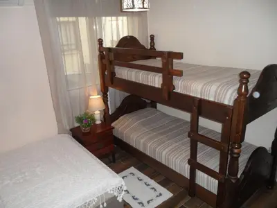 two bunk beds in a room with a window at SUNSHINE APTS, TWO BEDROOM , FREE INTERNET, No 3 in Ayia Napa