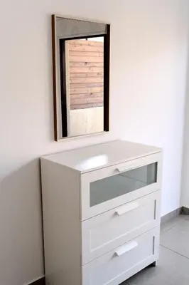 a bathroom with a white sink and a mirror at Lazaros Suite Downtown in Larnaka