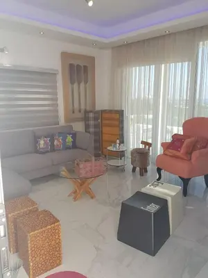 a living room with a couch and a chair at Villa Chrystalleni in Protaras