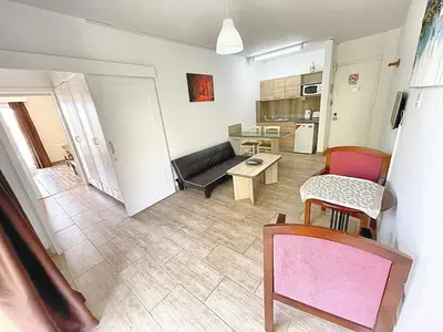 a living room with a couch and a table at Antonis G. Hotel Apartments in Voroklini