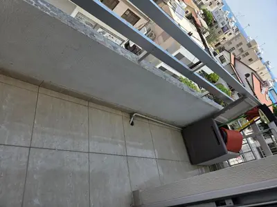 a tv sitting on the side of a building at One Bedroom aptm Larnaca in Larnaka