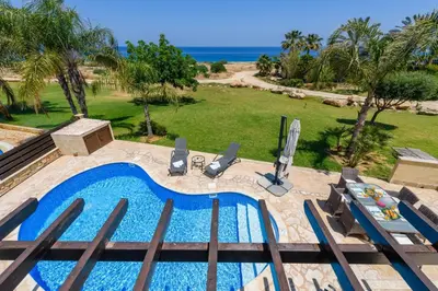 an overhead view of a swimming pool and the ocean at Villa Greco Mare #5 in Paralimni