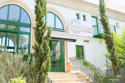 a building with trees in front of it at Limassol Marina Nereids D22 by Ezoria Villas in Limassol