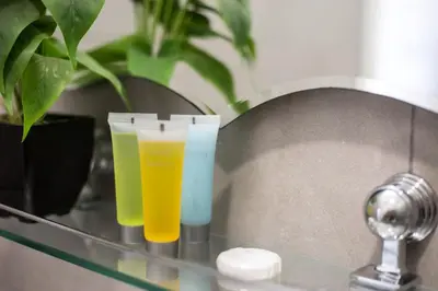 two glasses of juice sitting on a glass shelf at Rimon Cyprus Israeli Kosher Rooms in Larnaka