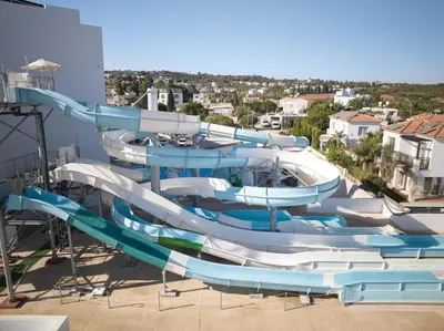 a water slide on top of a building at Maris Grand Waterpark Resort in Protaras