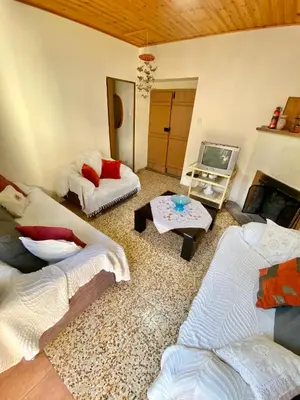 a living room with two couches and a tv at Saint Nicholas heights in Chakistra