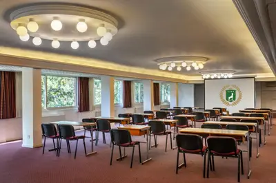 a dining room with tables and chairs in it at Forest Park Hotel in Platres