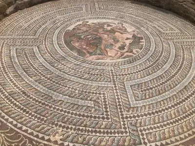a mosaic floor with a picture in the center at Mazotos Hills 3 in Mazotos