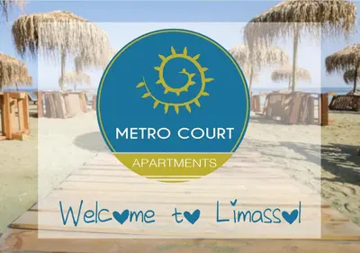 a sign for the metro court at the beach at Metro Court Apartments in Limassol
