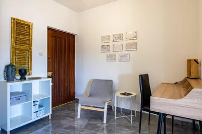 a room with a desk and a chair and a table at Engomi Apartment in Yukarı Lakatamya