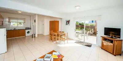a large kitchen and living room with a table at Villa Stefanie in Ayia Napa