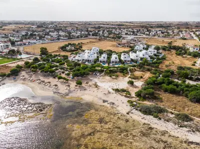 an aerial view of a beach with houses at Thalassines Villas in Ayia Napa