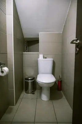 a bathroom with a toilet in a small room at Villa Costa Cornelia Homes in Ayia Napa