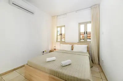 a bedroom with a bed with two towels on it at Sunrise Bay Villa #1 in Paralimni