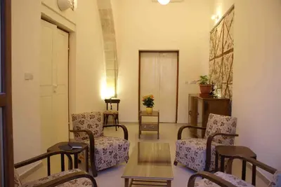 a waiting room with chairs and a table at Yiayia's House Limassol city in Limassol