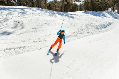 a person is skiing down a snow covered slope at Troodos Hotel & Spa in Troodos