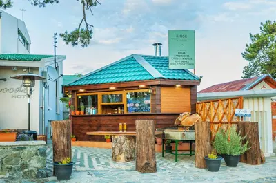 a small restaurant with a table in front of it at Troodos Hotel & Spa in Troodos