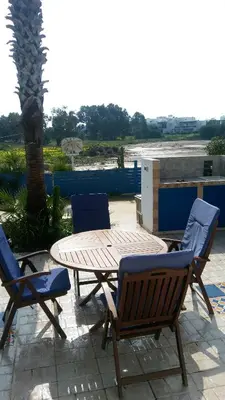 a patio with a table and two chairs and a table at Il Mare in Larnaka