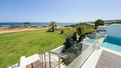 a view of the ocean from the balcony of a house at Luxury Bay View Villa 28 Right On The Beach in Protaras