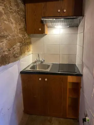 a kitchen with a sink and a counter top at Pachna Studios - Village Life in Limassol