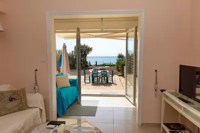 a living room with a view of the ocean at Mariliz in Larnaka