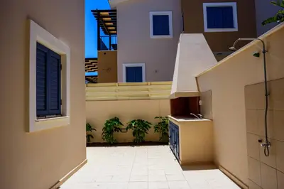 a view of a balcony of a building with plants at Indigo in Protaras