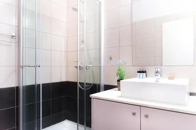 a bathroom with a shower and a sink at Napian Suites in Ayia Napa