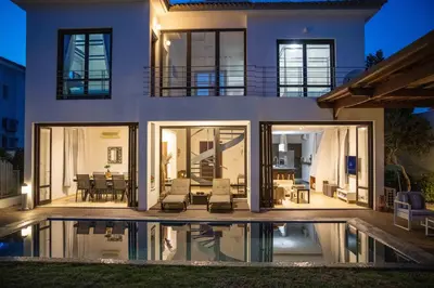 a house with a pool in front of it at Balinese in Ayia Napa