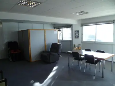 a meeting room with a table and chairs in an office at Datacom Guest House in Nicosia