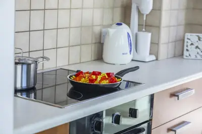 a bowl of fruit on a stove in a kitchen at Villa Mylos 8 in Protaras