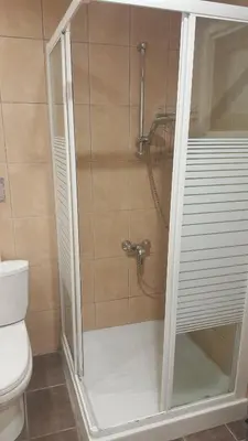 a shower in a bathroom with a toilet at Manoli Apartments in Ayia Napa