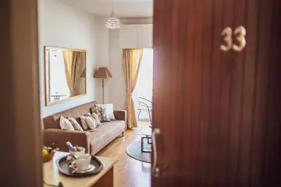 a living room with a couch and a table at Beach Haven in Larnaka