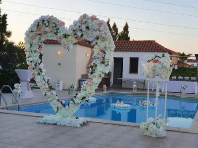 a heart shaped altar in front of a swimming pool at Larnaca Mansion Ideal for 3 Families or more in Larnaka