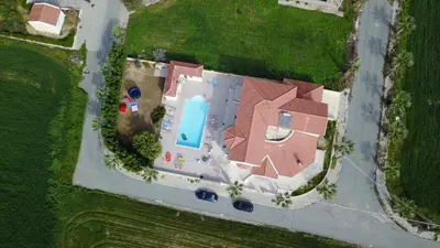 an overhead view of a house with a swimming pool at Larnaca Mansion Ideal for 3 Families or more in Larnaka