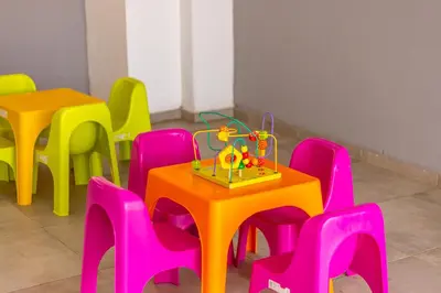 a group of tables and chairs in a room at Milea Hotel in Ayia Napa