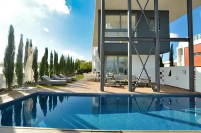 a large swimming pool in front of a building at White Pearl Villas in Protaras